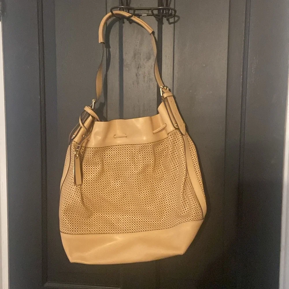 Vince Camuto Sand Perforated Drawstring Hobo Bag with leather pouch